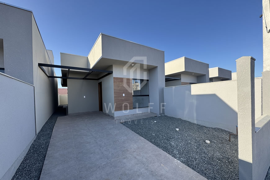 JD1612 - Casa Geminada com Passagem Lateral e Fachada Moderna